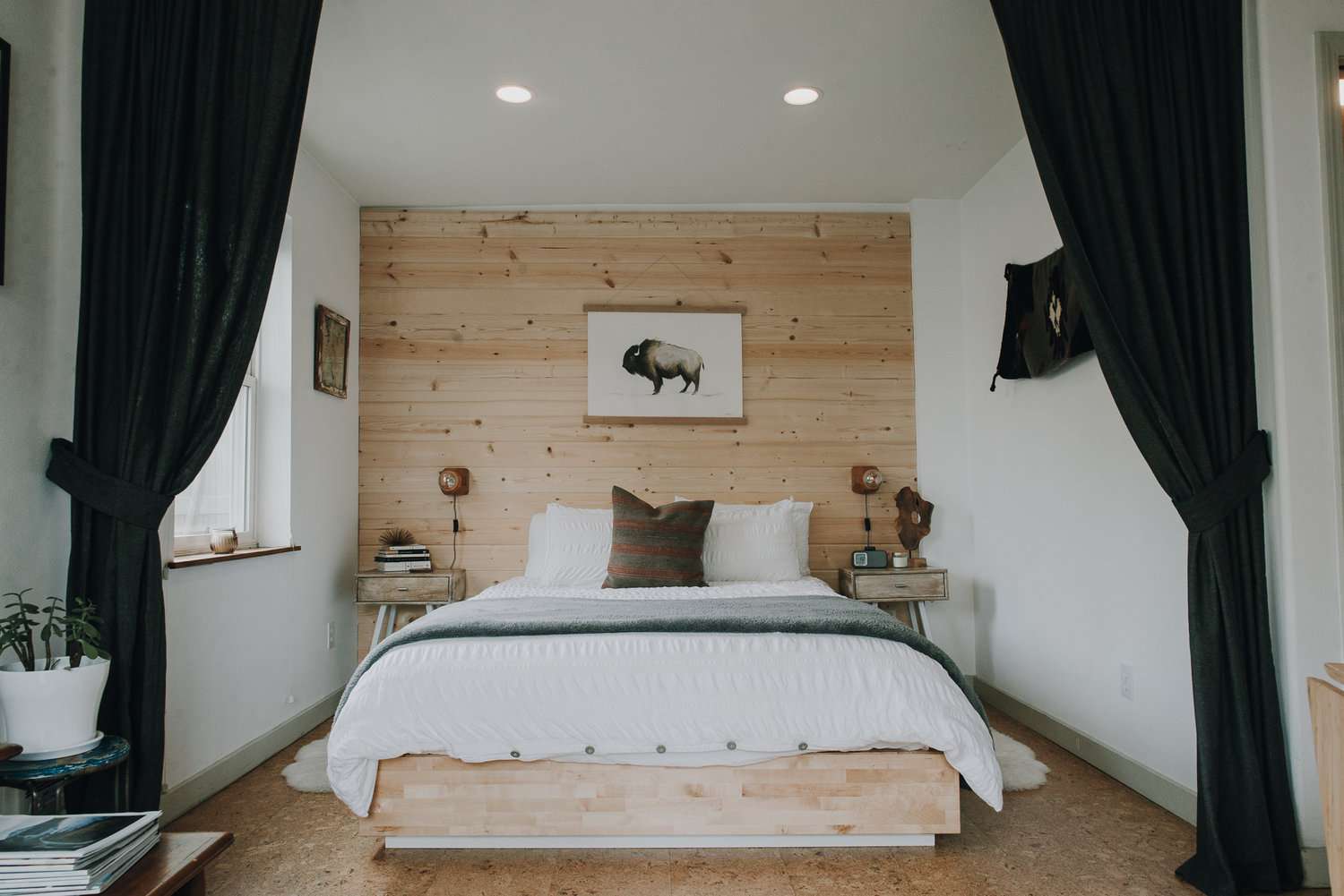 bedroom with warm wood accent wall