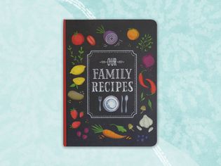 Our Family Recipes Journal on a blue background