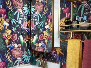 colorful powder room with floral wallpaper