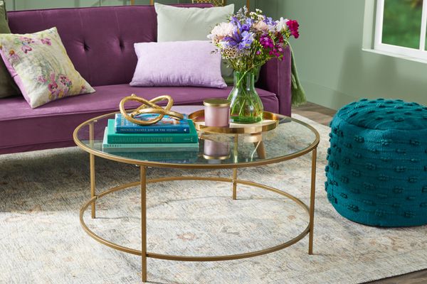 Modern round coffee table with gold accents