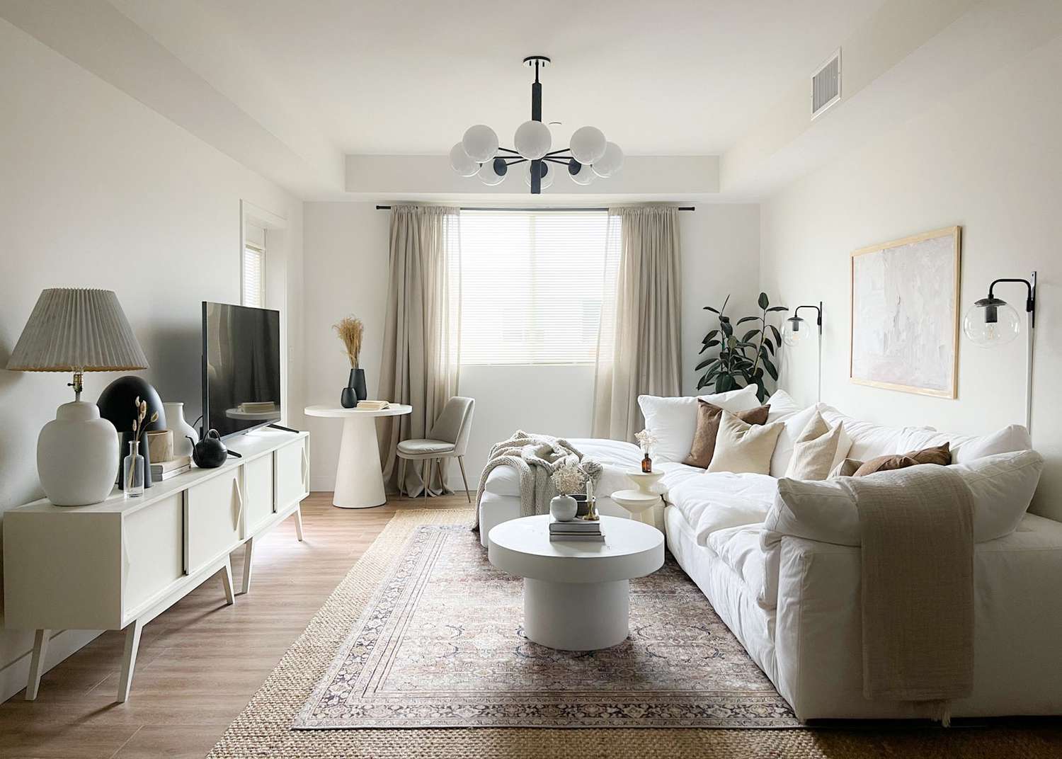modern living room with neutral palette and round accents