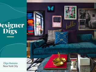 Eclectic NYC apartment with teal velvet sofa and lots of wall art. 