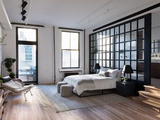 white exposed brick loft bedroom