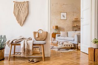 A boho style living room with natural colors