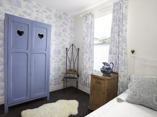 Blue toile in a cottage bedroom.