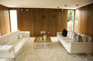 A mid-century modern living room with popcorn ceilings