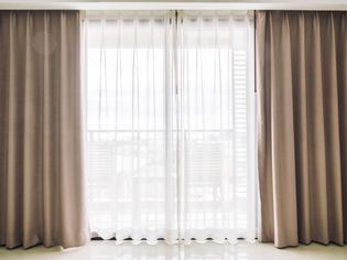Beige and white floor to ceiling curtains