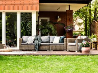 Casual outdoor patio with furniture and plants