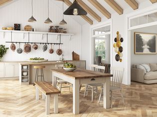 Rustic farmhouse table in a kitchen with exposed beams