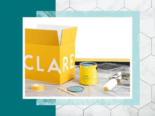 Clare paint can and box surrounded by painting supplies