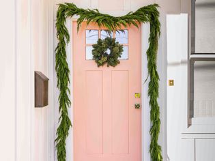 Front view of a door with garland 