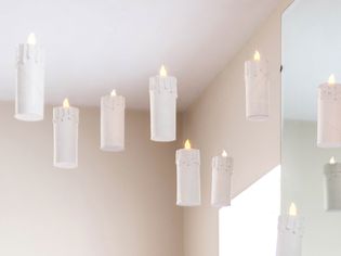 White DIY floating candles near mirror and ceiling