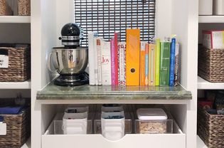 organized kitchen with books and bins