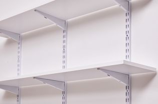 Wall shelves installed with standards and brackets