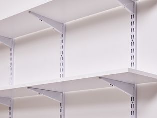 Wall shelves installed with standards and brackets