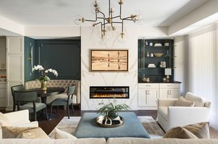 modern living room with statement lighting and hearth