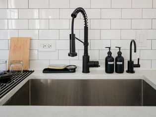 Kitchen sink with hot water dispenser tap