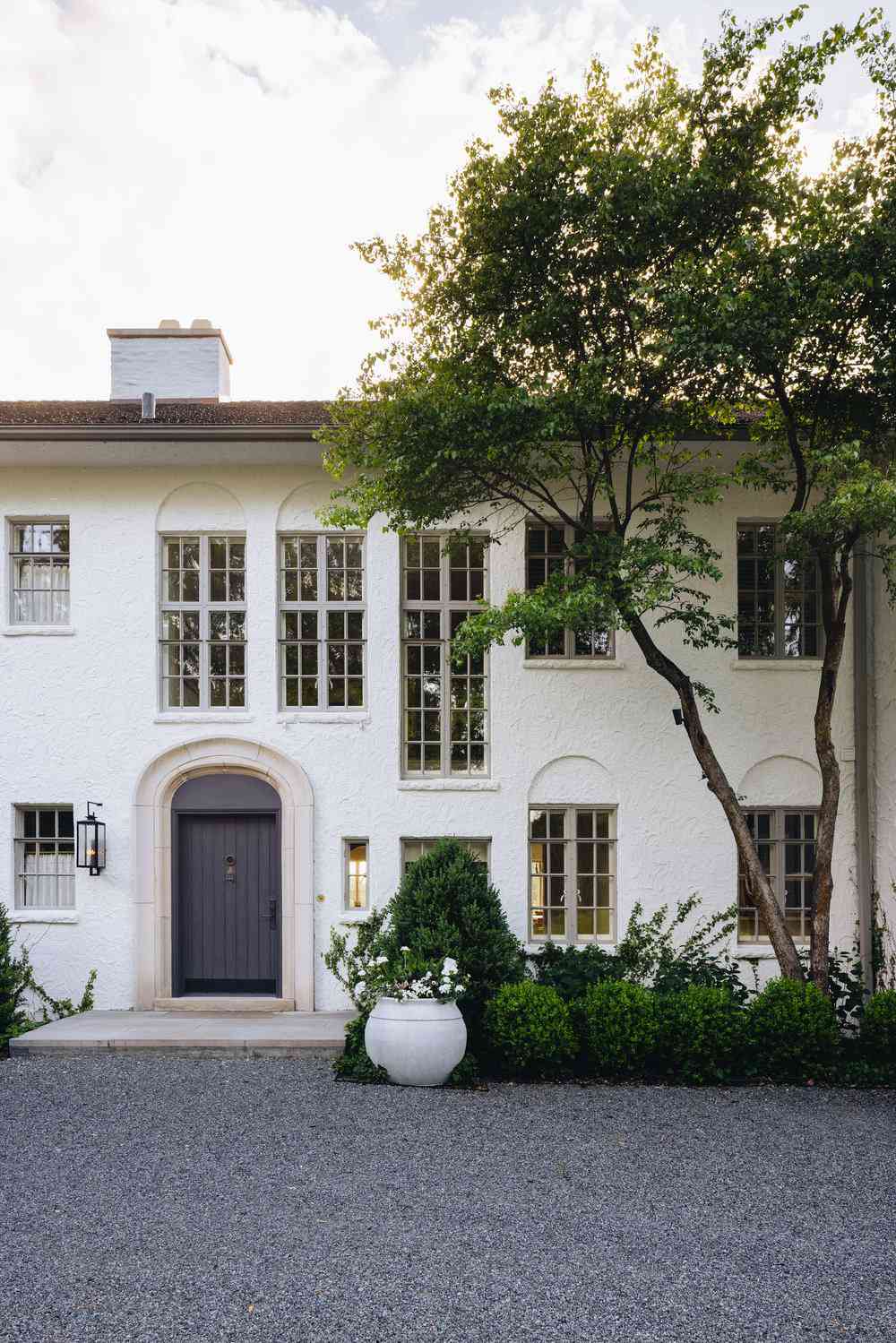 White house with arched black front door