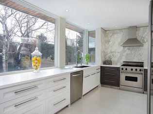 Luxury Kitchen with Large Marble Laminate Backsplash