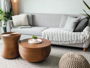 Living room incorporating colors like white, gray, and metallics. The circular shape is associated with this area.