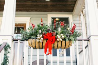 Outdoor Christmas decorations hanging on porch railing