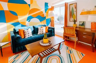 Bold colorful living room with vintage inspired accents.
