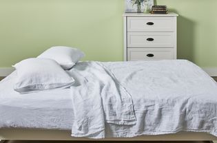 Pillows and mattress covered in the Brooklinen Linen Core Sheet Set