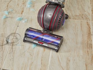 Dyson Ball Animal 3 Extra Vacuum cleaning fuzz and hair from tile floor
