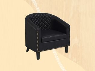 Black Accent Chair on a yellow patterned background