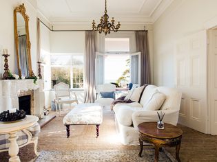 Traditional and elegant styled living room with neutral colors and architectural details