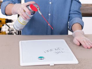 Spraying white board with WD-40