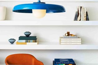 Table with a bold blue pendant lamp