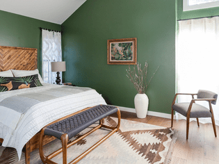 Green wall paint in a bedroom
